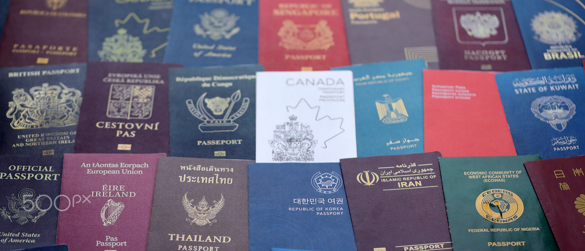 Big amount of passports of various different countries. Covers of expired passports close up