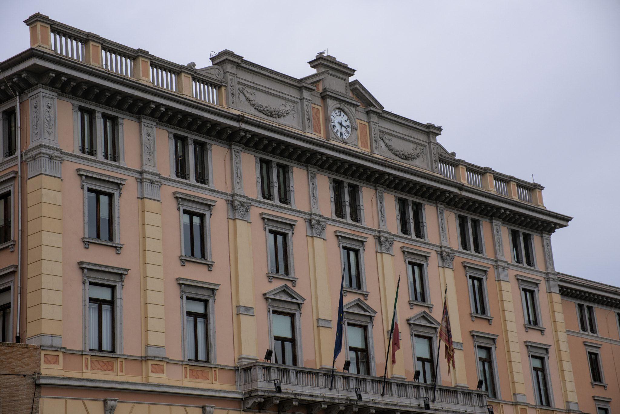 Grand facade with clock tower in European city