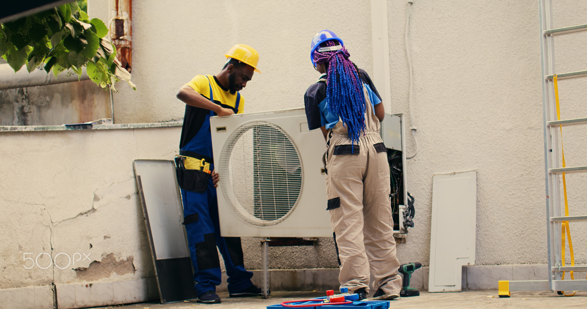 Experts working on air conditioner