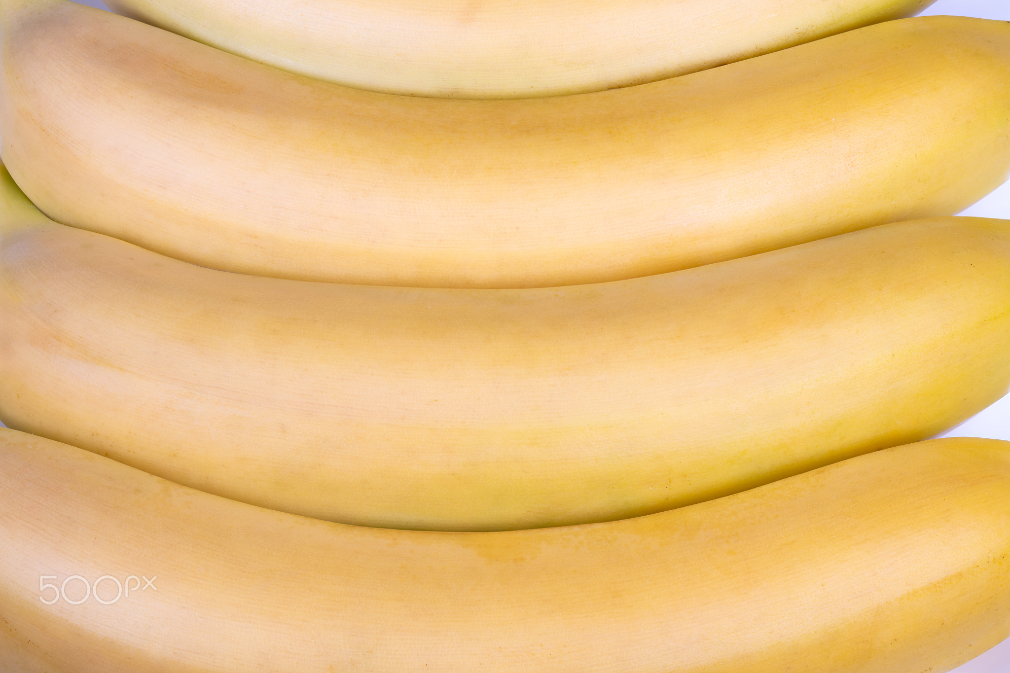 Vivid yellow banana design emphasizing recurring curves and textured peel. Bold yellow visual featur