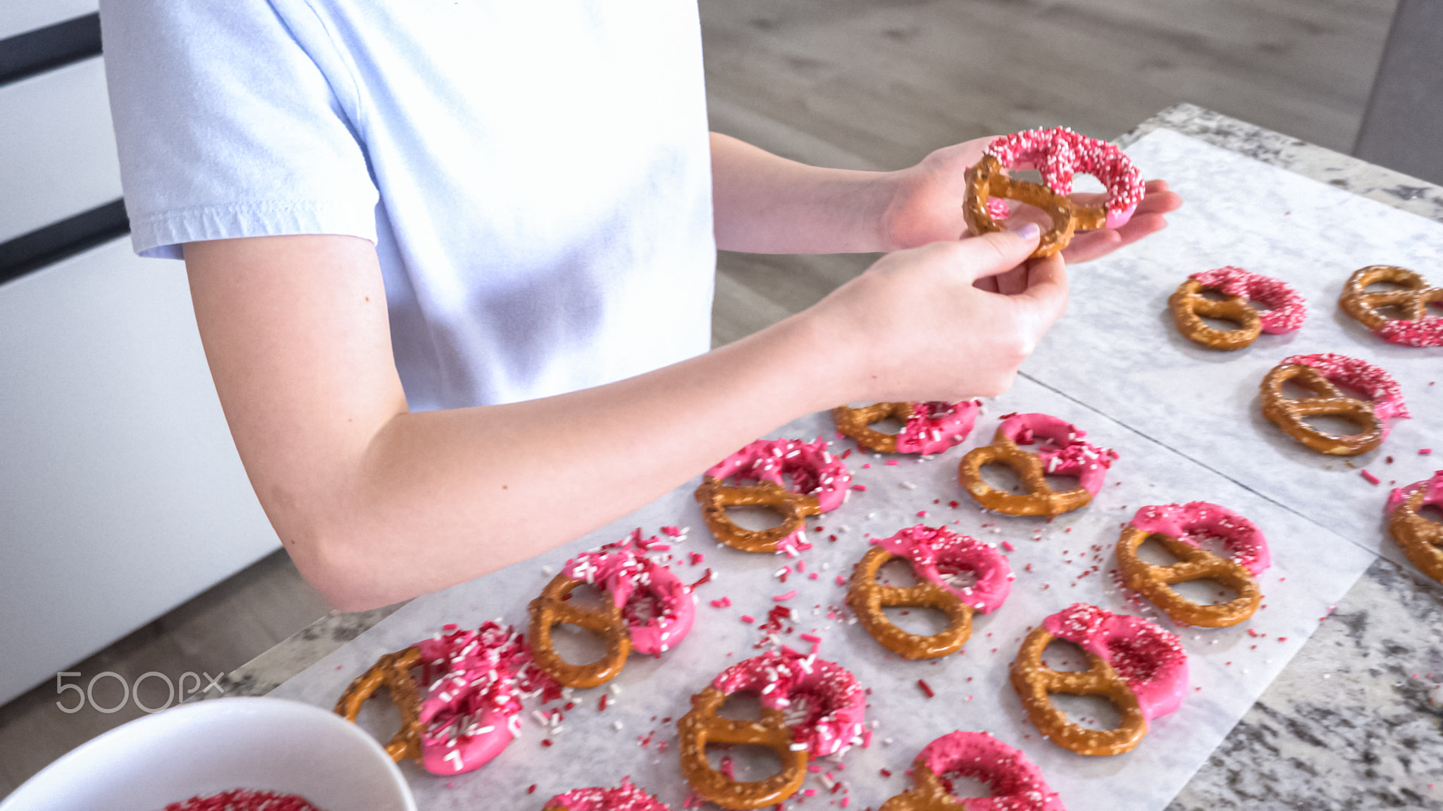 Young Chef Prepares Chocolate-Covered Treats in Sunny Kitchen