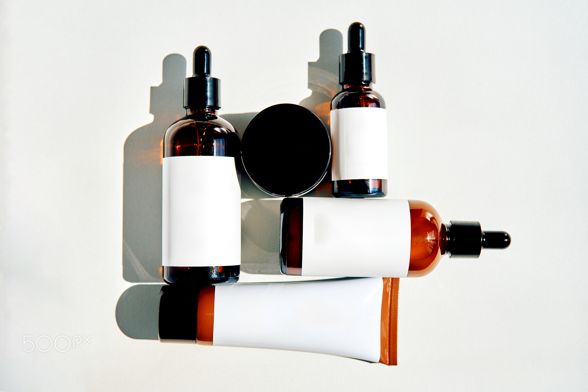 Cosmetic bottles with blank labels offering glp 1 skin support