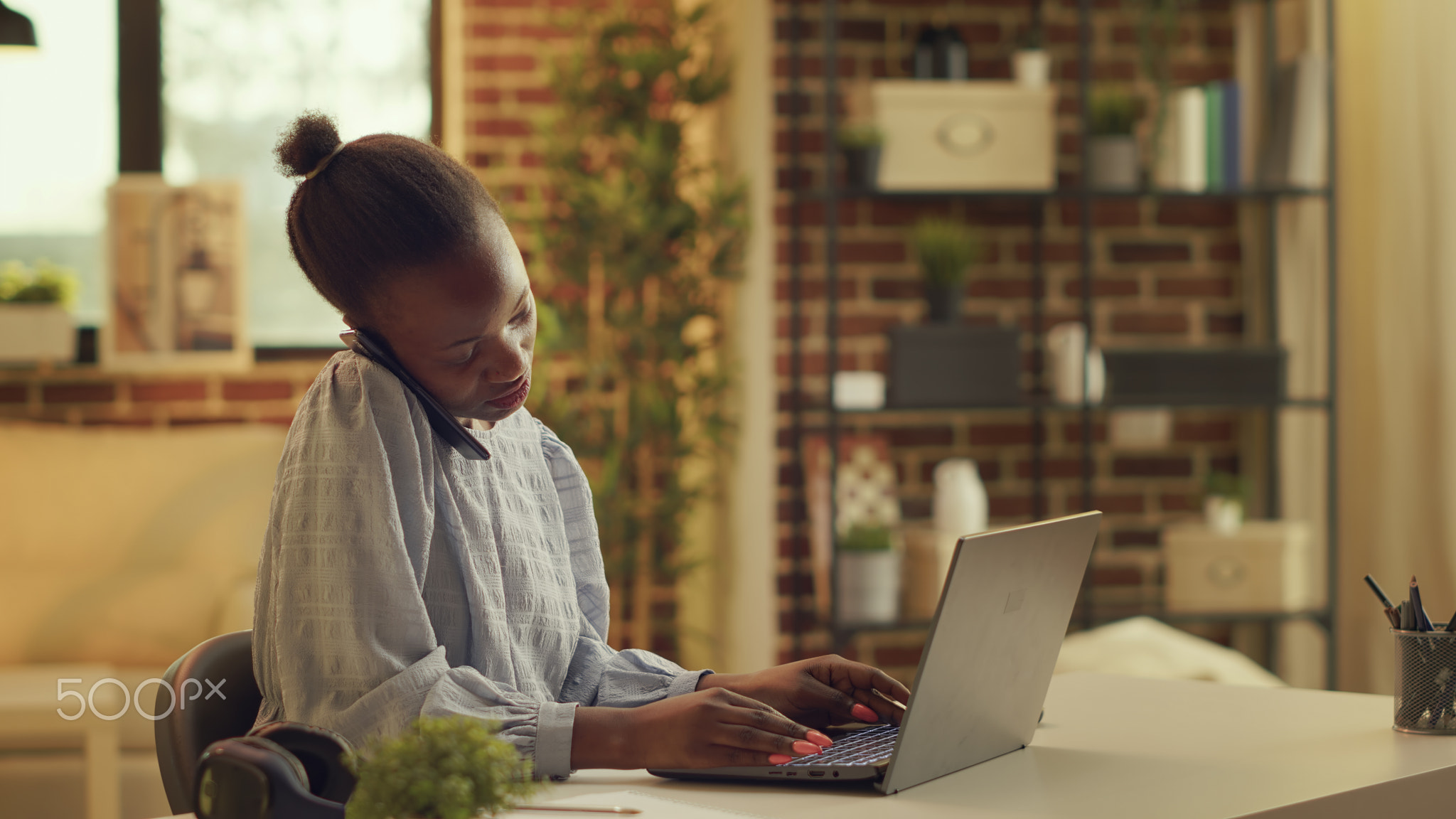 Teleworker take phone call while working