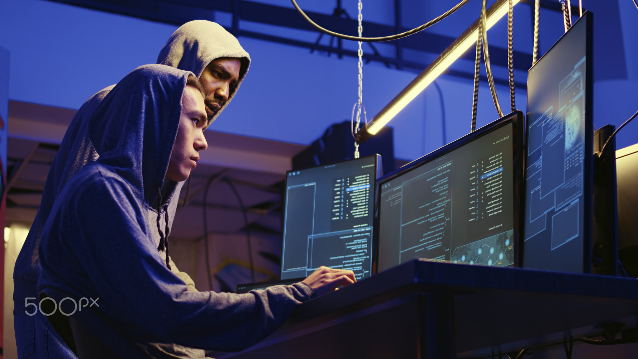 Hackers brainstorming ways of getting past anti tamper measures implemented by companies trying to