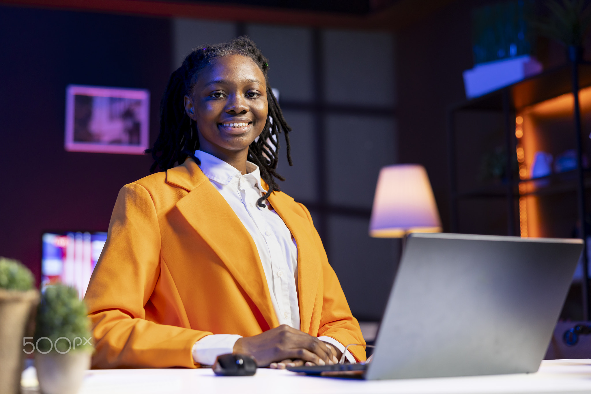 Portrait of smiling student at home doing homework