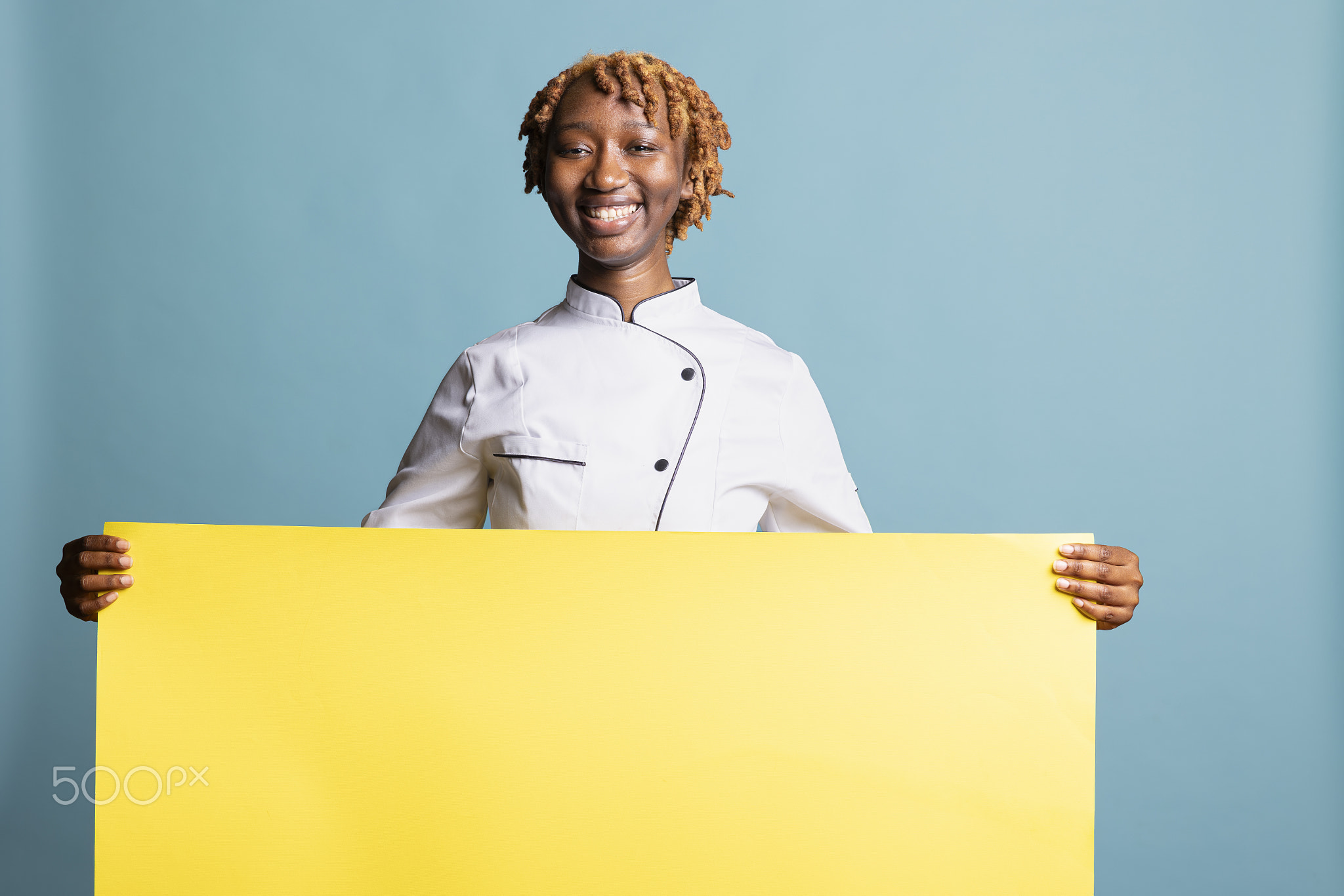 Black professional cook presents mockup placard for restaurant ads