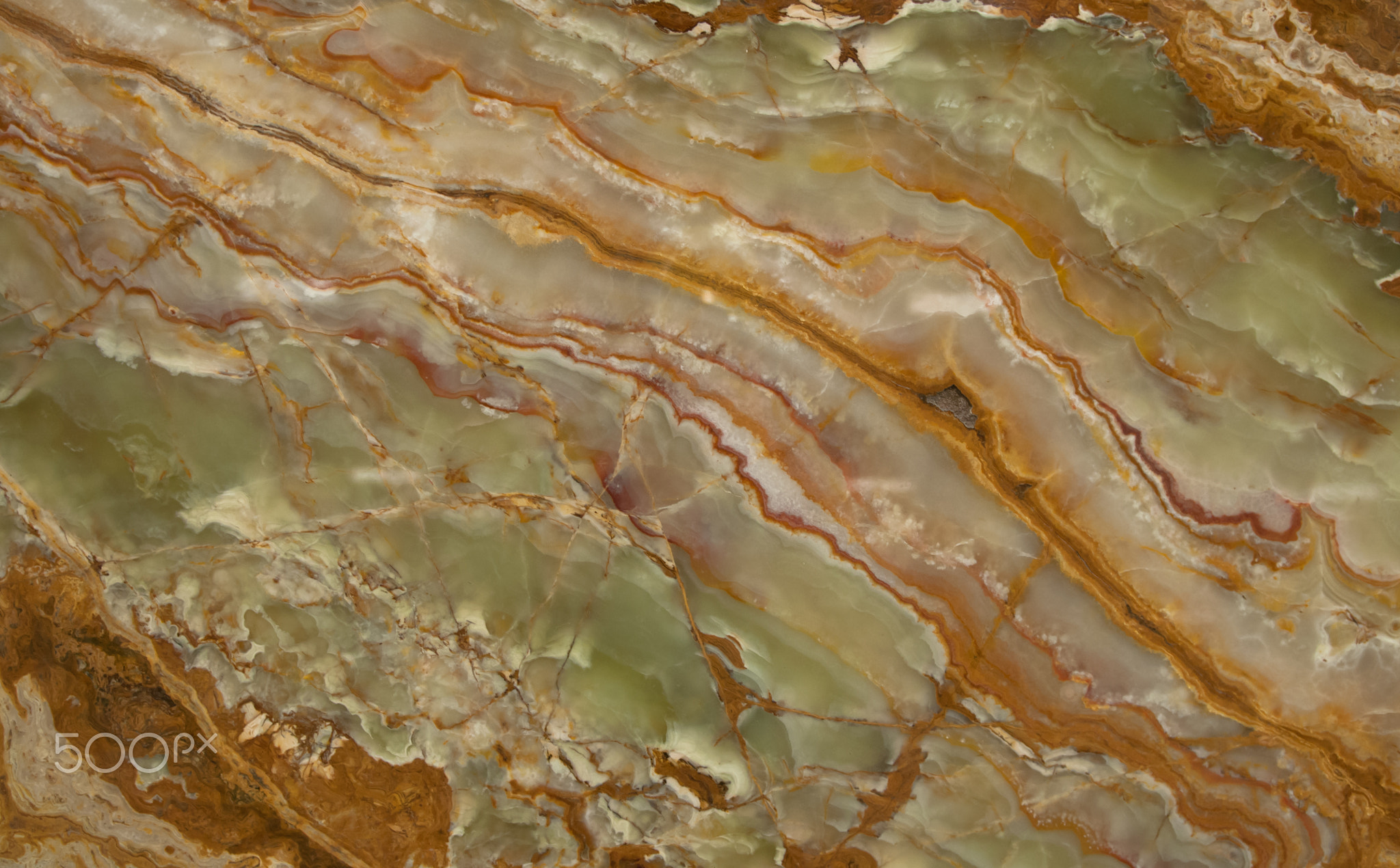 Close-up of a green and orange slab of marble