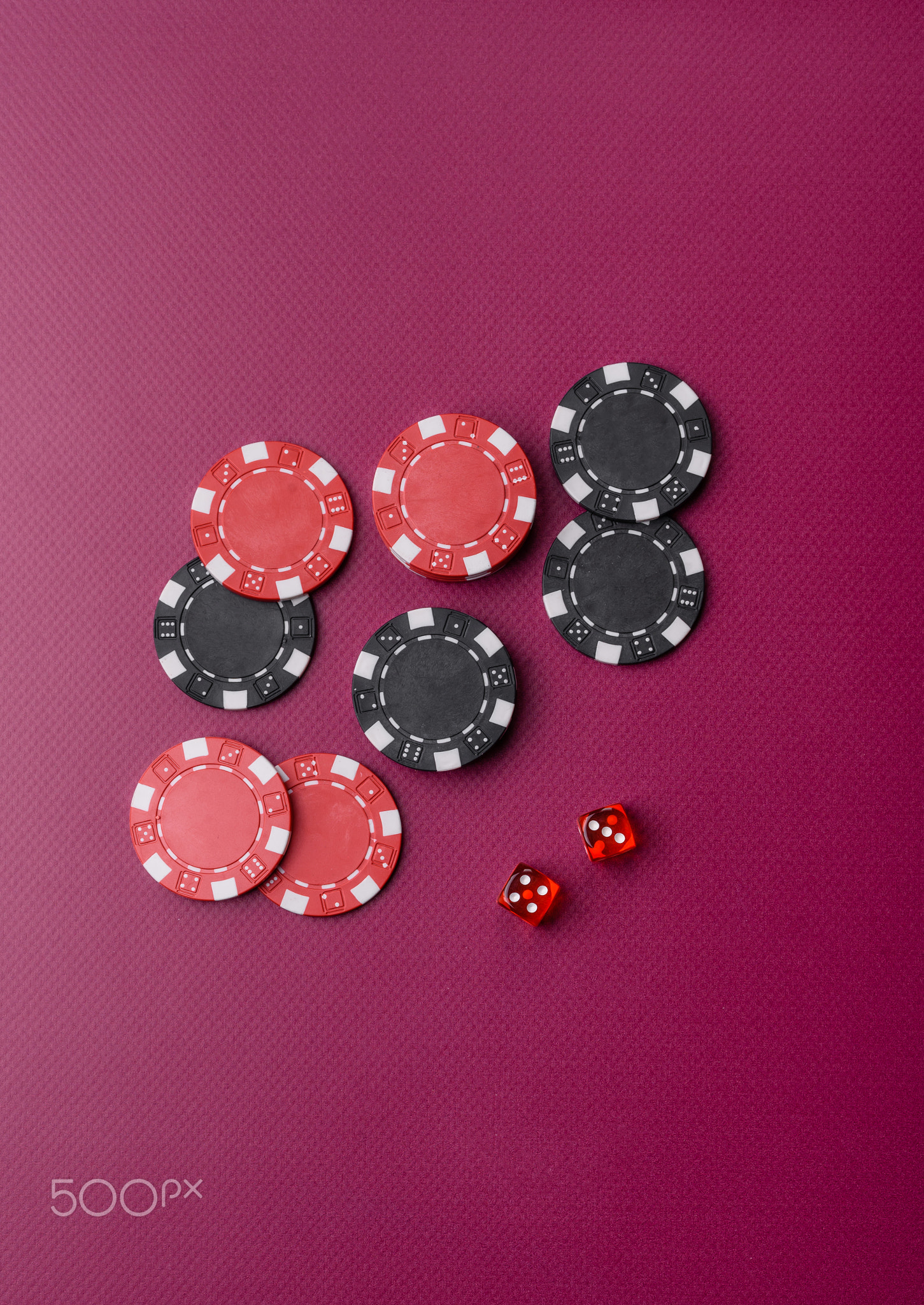 Casino dice and chips on a colored background, poker, gambling with bets. Dice and chips