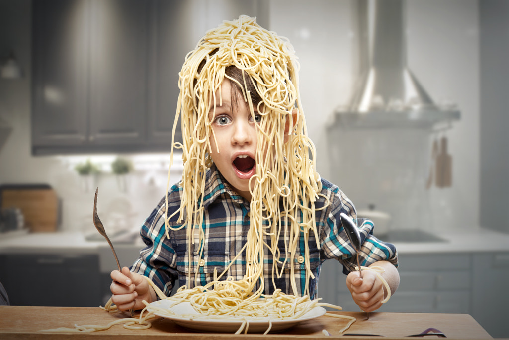 Surprised boy with pasta on the head by artur k on 500px.com