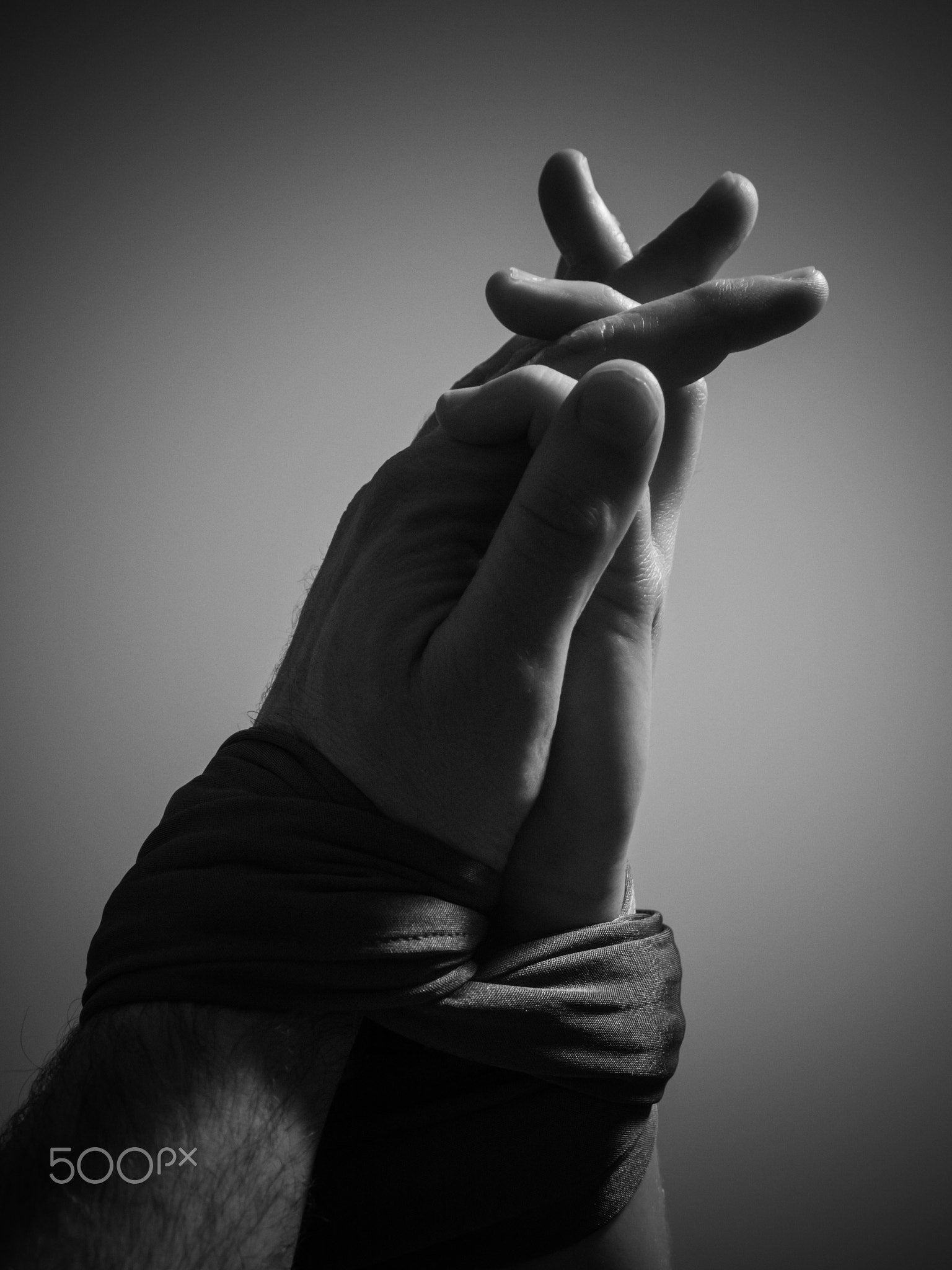 Two hands bound together