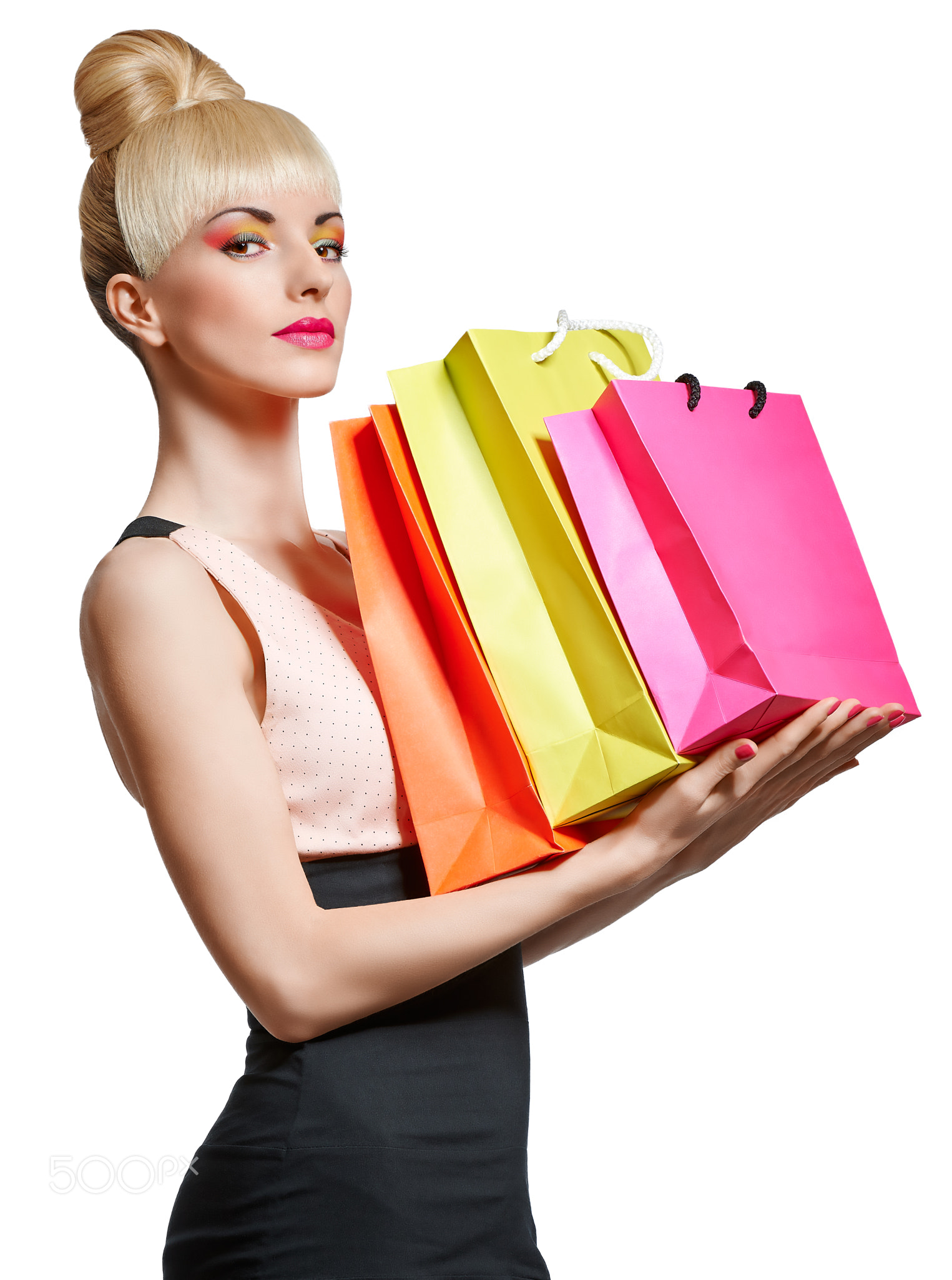 Portrait of beauty woman holding shopping bags, isolated