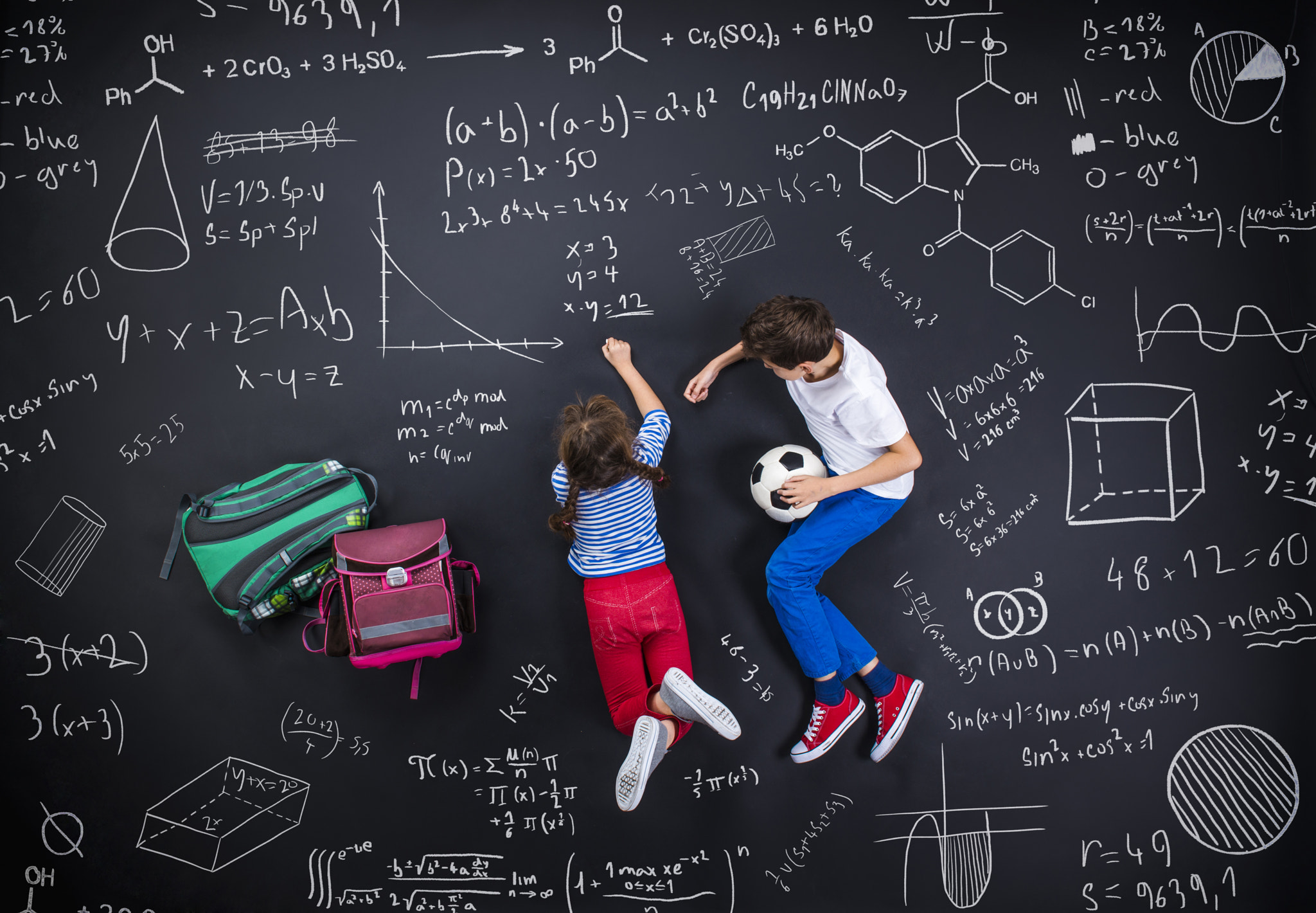 Two schoolkids learning