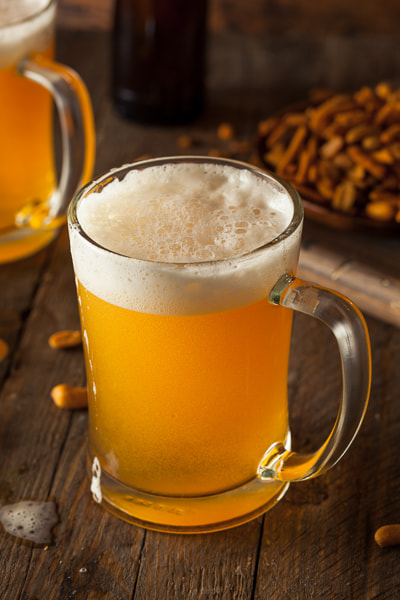 Golden Beer in a Glass Stein