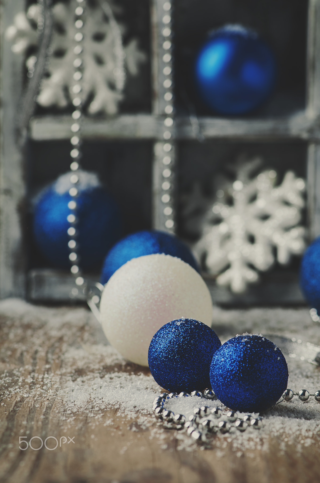 Christmas card with balls on the wooden table