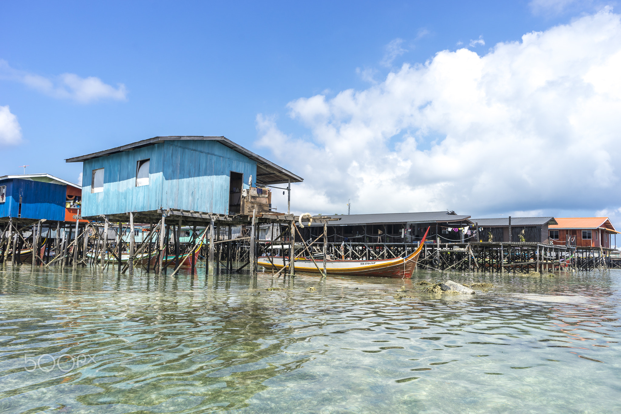 SABAH, MALAYSIA - AUGUST 15, 2015 : Traditional floating resort at Mabul Island, Sabah, Malaysia.