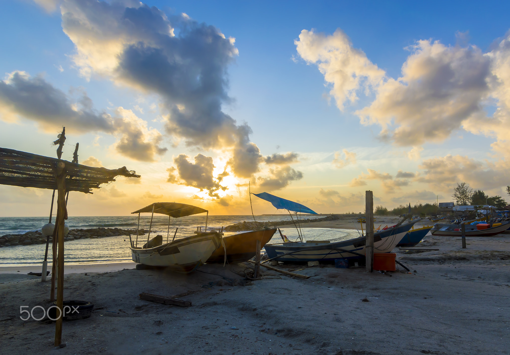 Sunrise view with traditional wooden boat foreground
