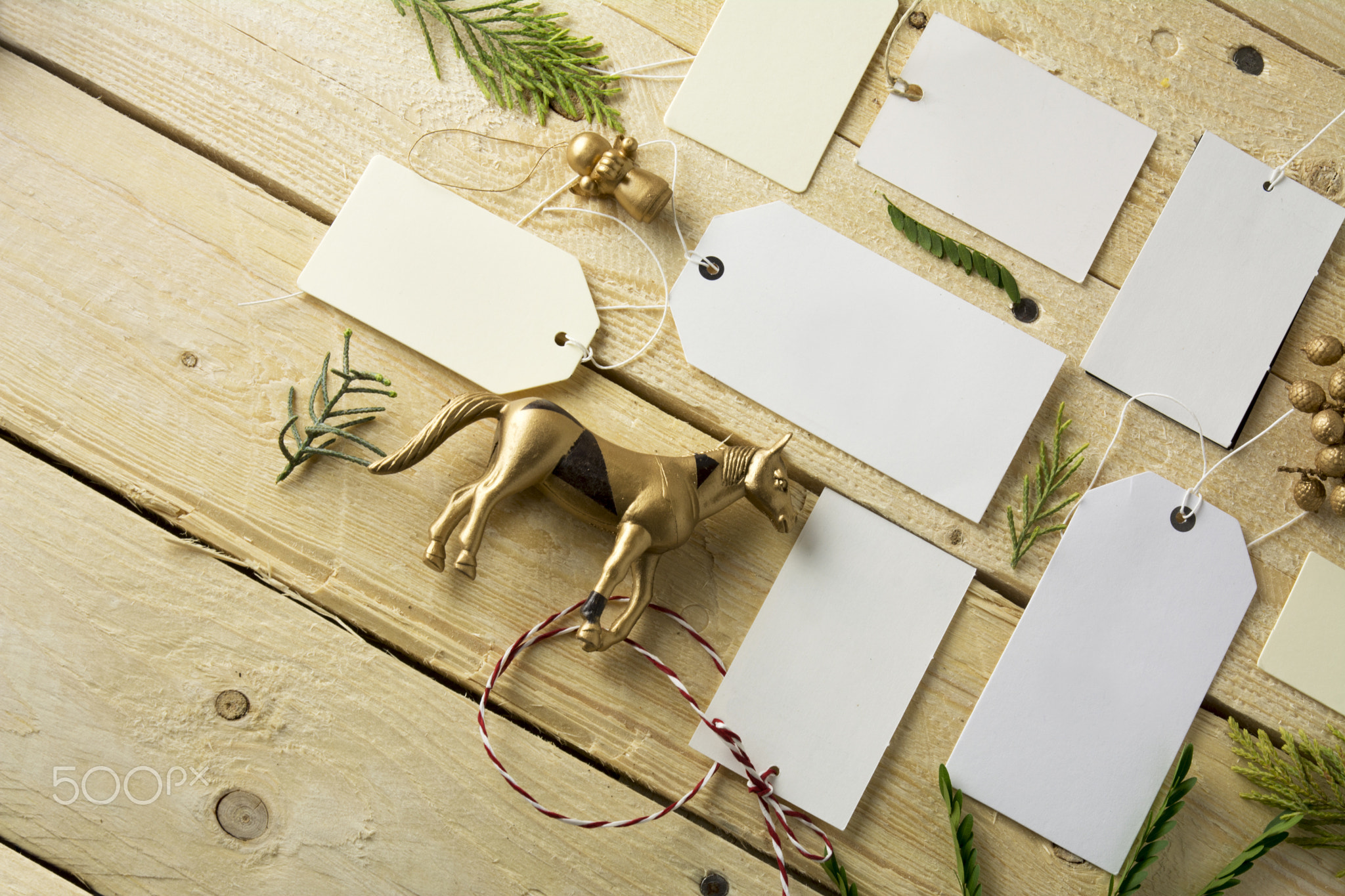 Set of empty paper price tags, wooden background