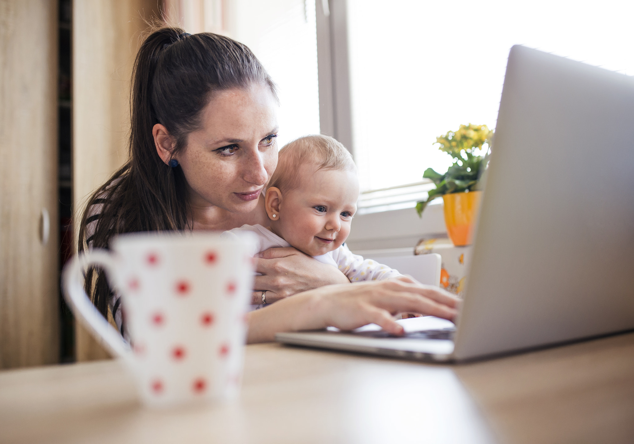 Young mother working from home