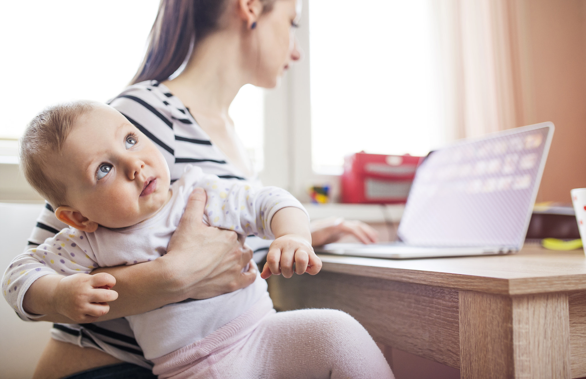 Young mother working from home