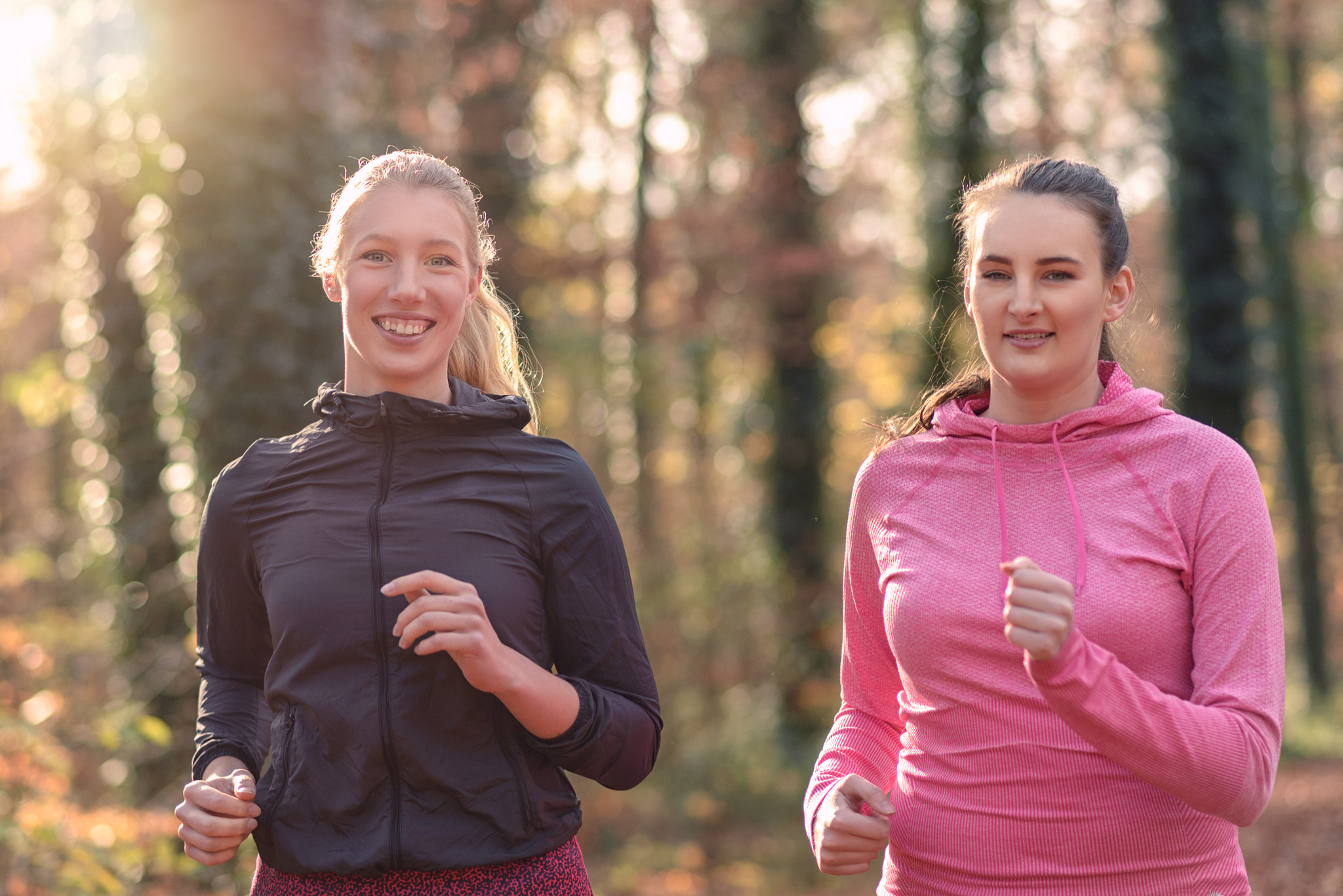 Two attractive fit young ladies out jogging