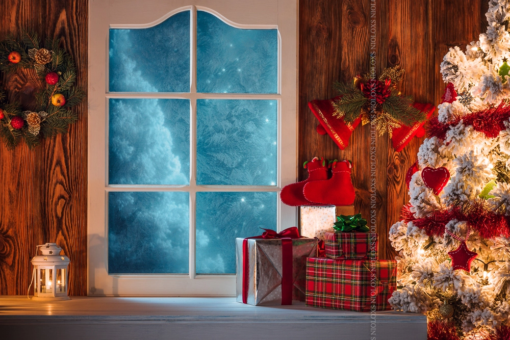 Christmas scene with tree gifts and frozen window in background by Kamil Zabłocki on 500px.com