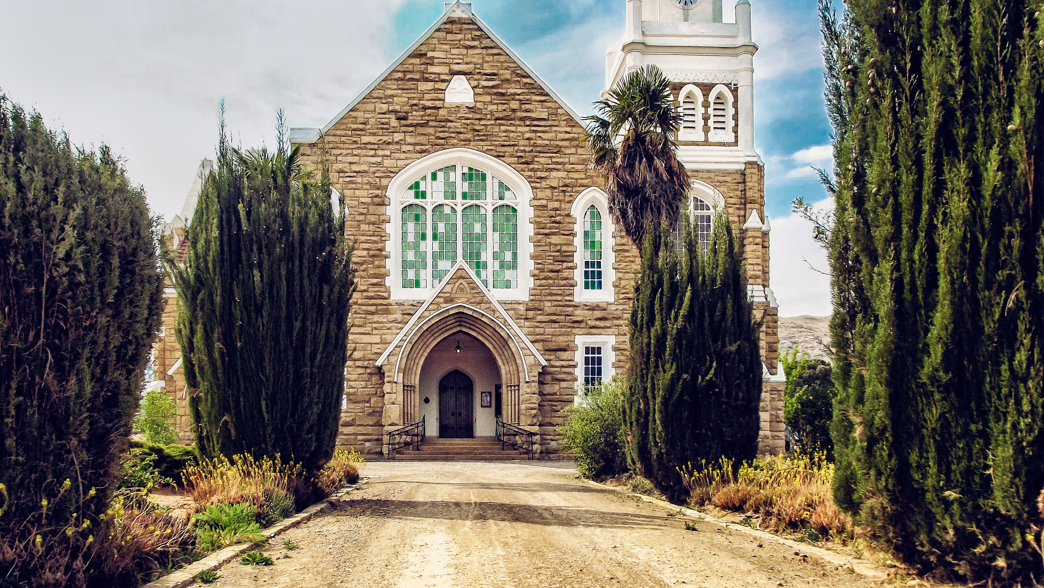 Fujifilm FinePix S2960 sample photo. Lady grey vintage church front view photography