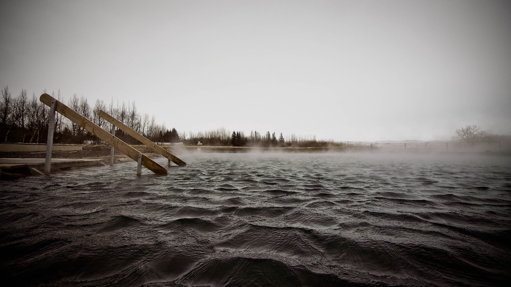 Olympus OM-D E-M5 + Panasonic Lumix G Vario 7-14mm F4 ASPH sample photo. Secret lagoon in iceland photography