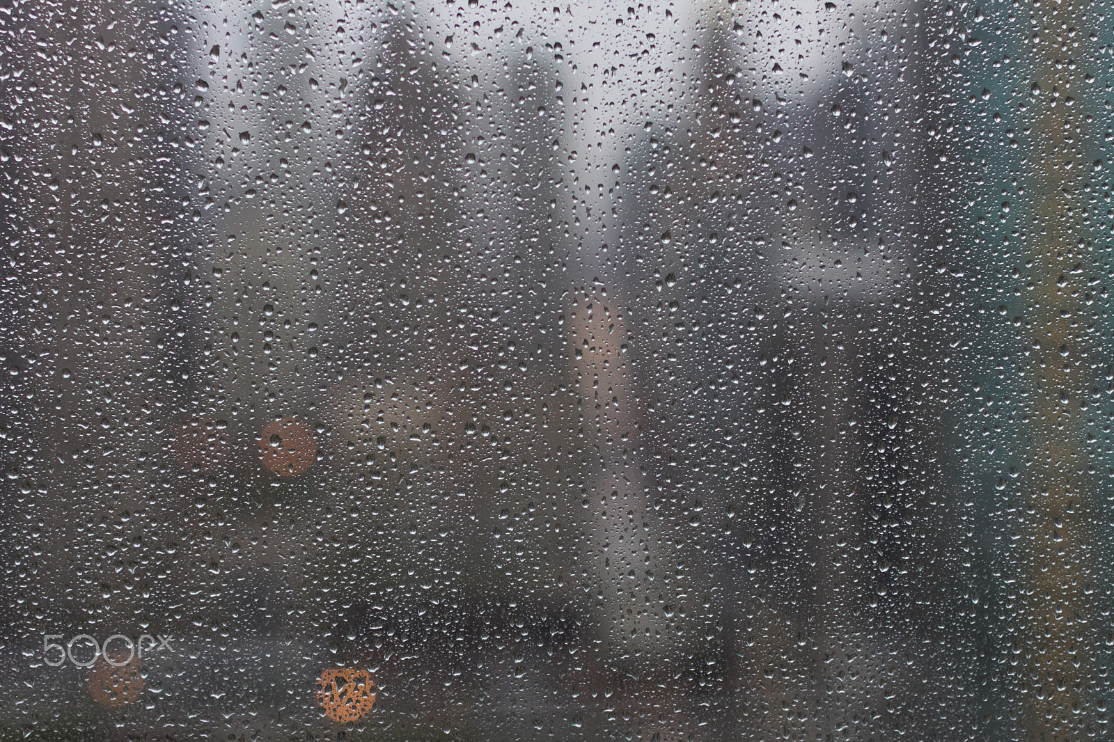 Canon EOS 60D + Canon EF 50mm F1.2L USM sample photo. Rainy city window photography
