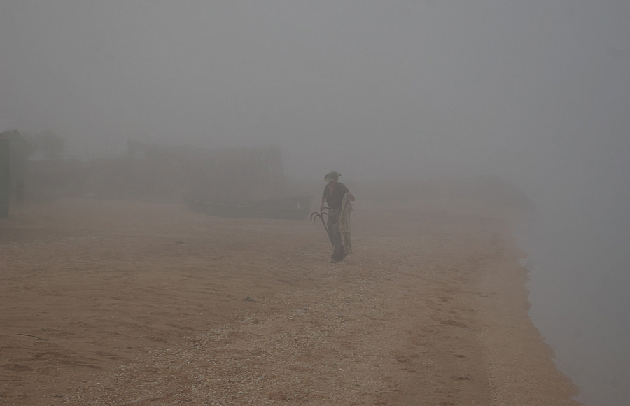 Pentax K110D sample photo. Fisherman in the fog. photography