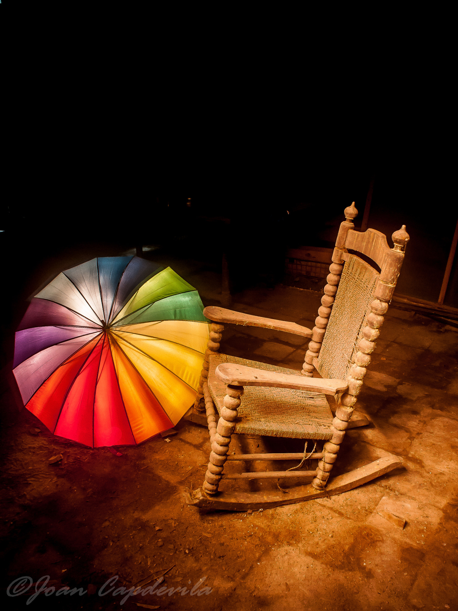 Sigma 14mm F3.5 sample photo. The old rocking chair and a psychedelic umbrella photography