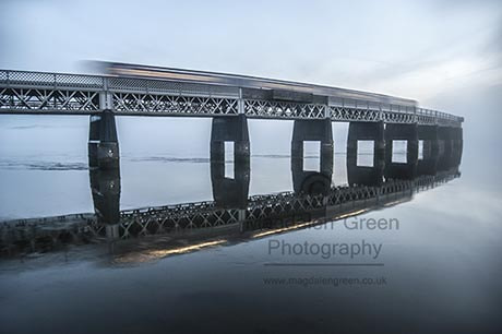 Nikon D700 + AF-S DX Zoom-Nikkor 18-55mm f/3.5-5.6G ED sample photo. Train glides effortlessly over tay rail bridge on icy blue eveni photography