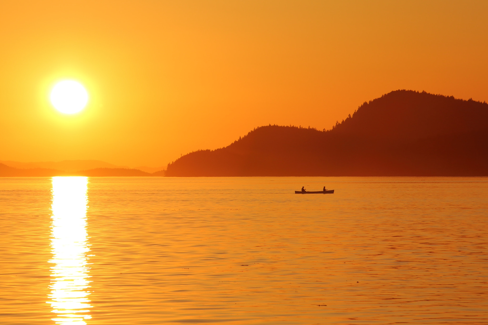 Canon EF 28-135mm F3.5-5.6 IS USM sample photo. Canoe in the sunset photography