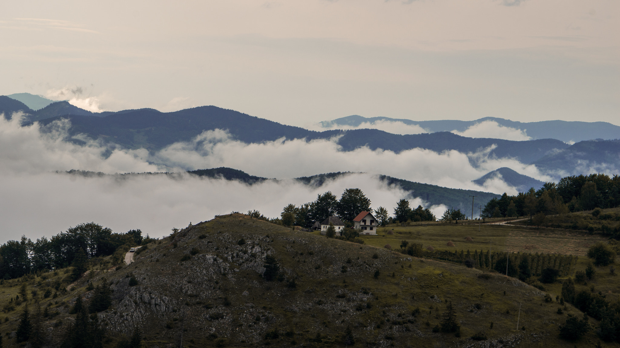 Pentax K-500 + Pentax smc DA 50-200mm F4-5.6 ED sample photo. Road in the foggy mountains photography