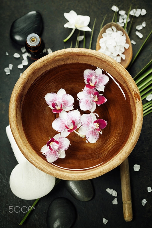 Spa background with floating flowers