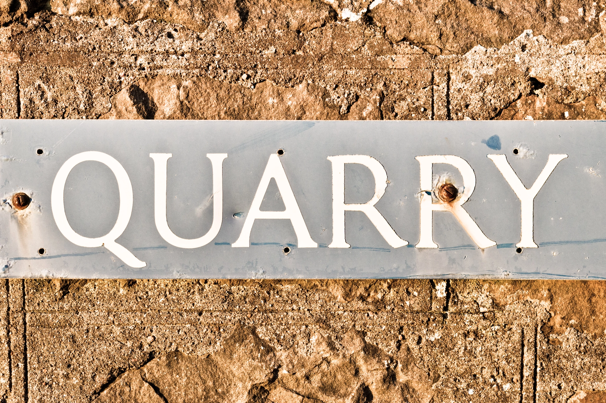 Sony Alpha NEX-5 + E 50mm F1.8 OSS sample photo. Quarry sign photography