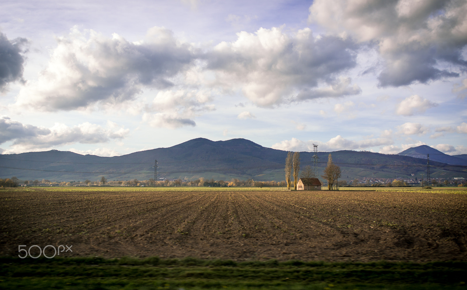 Sony Alpha NEX-7 + Sony 28mm F2.8 sample photo. House in a crop field photography
