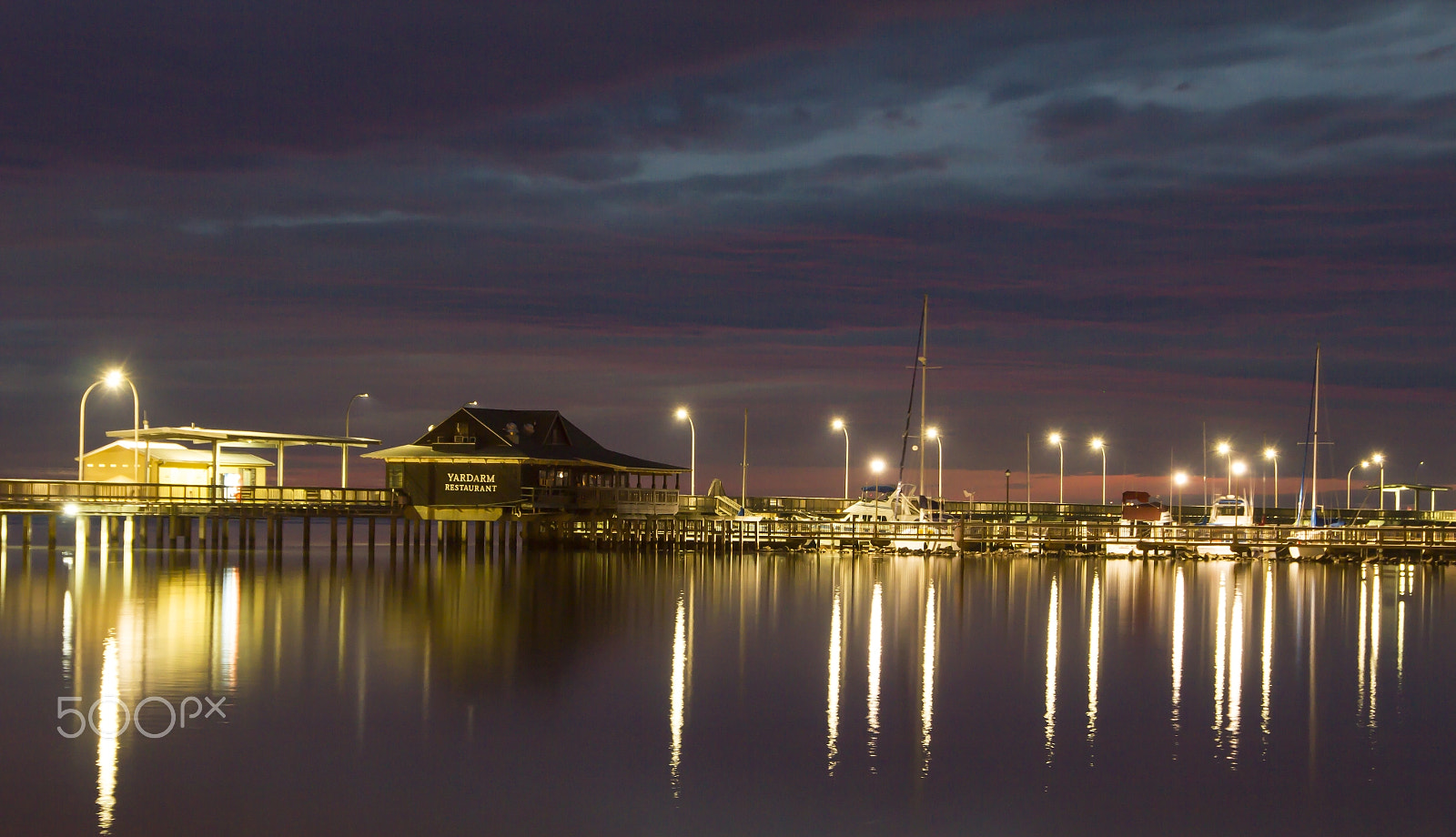 Sigma 18-250mm F3.5-6.3 DC OS HSM sample photo. A night view of a pier photography