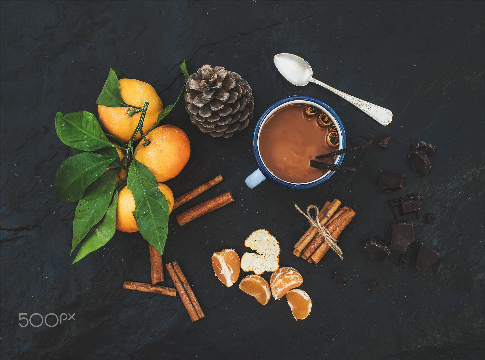 Nikon D610 + ZEISS Distagon T* 35mm F2 sample photo. Christmas or new year items. fresh mandarins with leaves, cinnamon sticks, vanilla, pine cone and mu photography