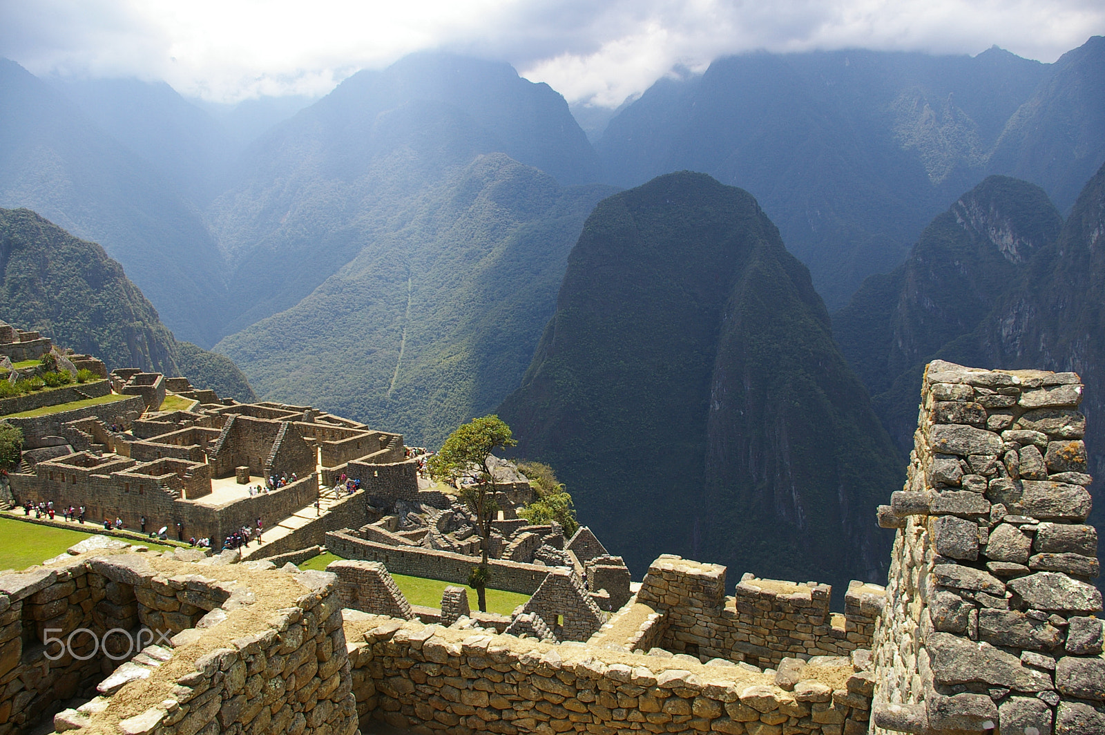 Pentax *ist DL2 sample photo. Sun breaking through the clouds over machu picchu photography