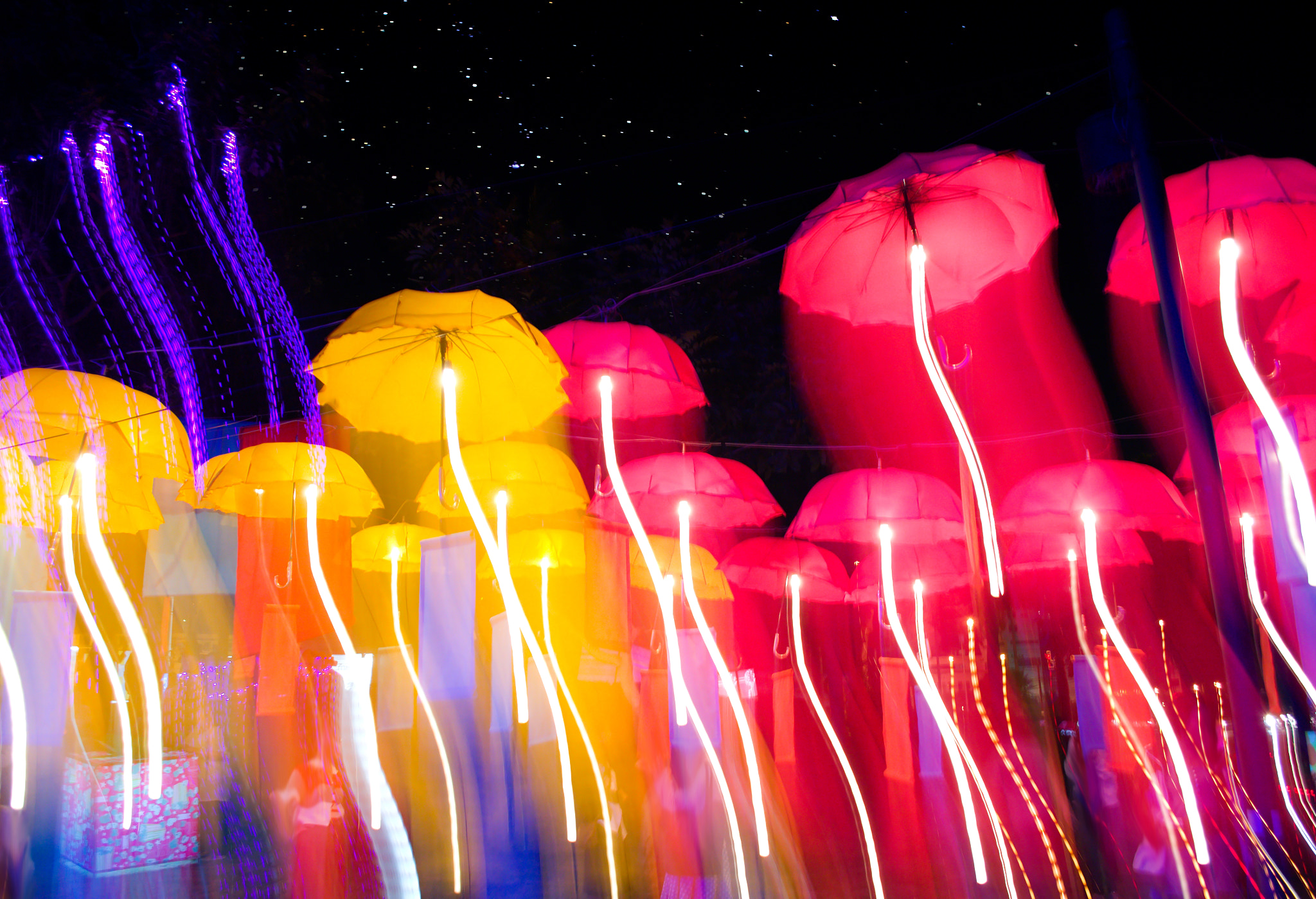18.00 - 55.00 mm f/3.5 - 5.6 sample photo. Speed of umbrellas neon light photography