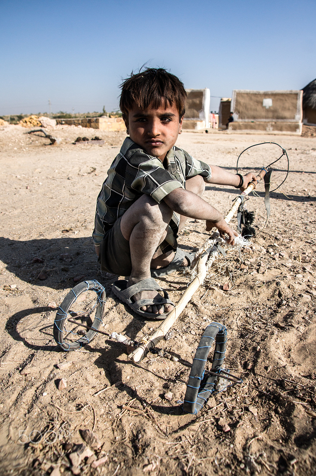 Sony Alpha DSLR-A550 sample photo. Young boy with toy photography