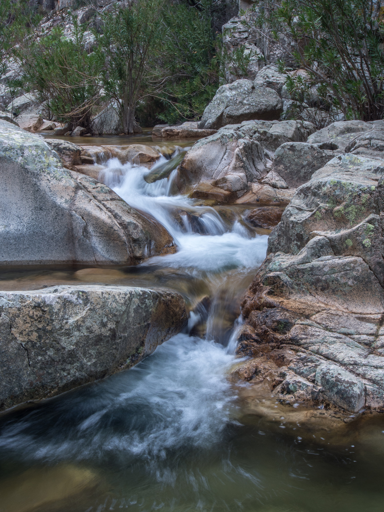 Olympus PEN E-P5 + OLYMPUS M.12-50mm F3.5-6.3 sample photo. Water plays between rocks - sardinia photography