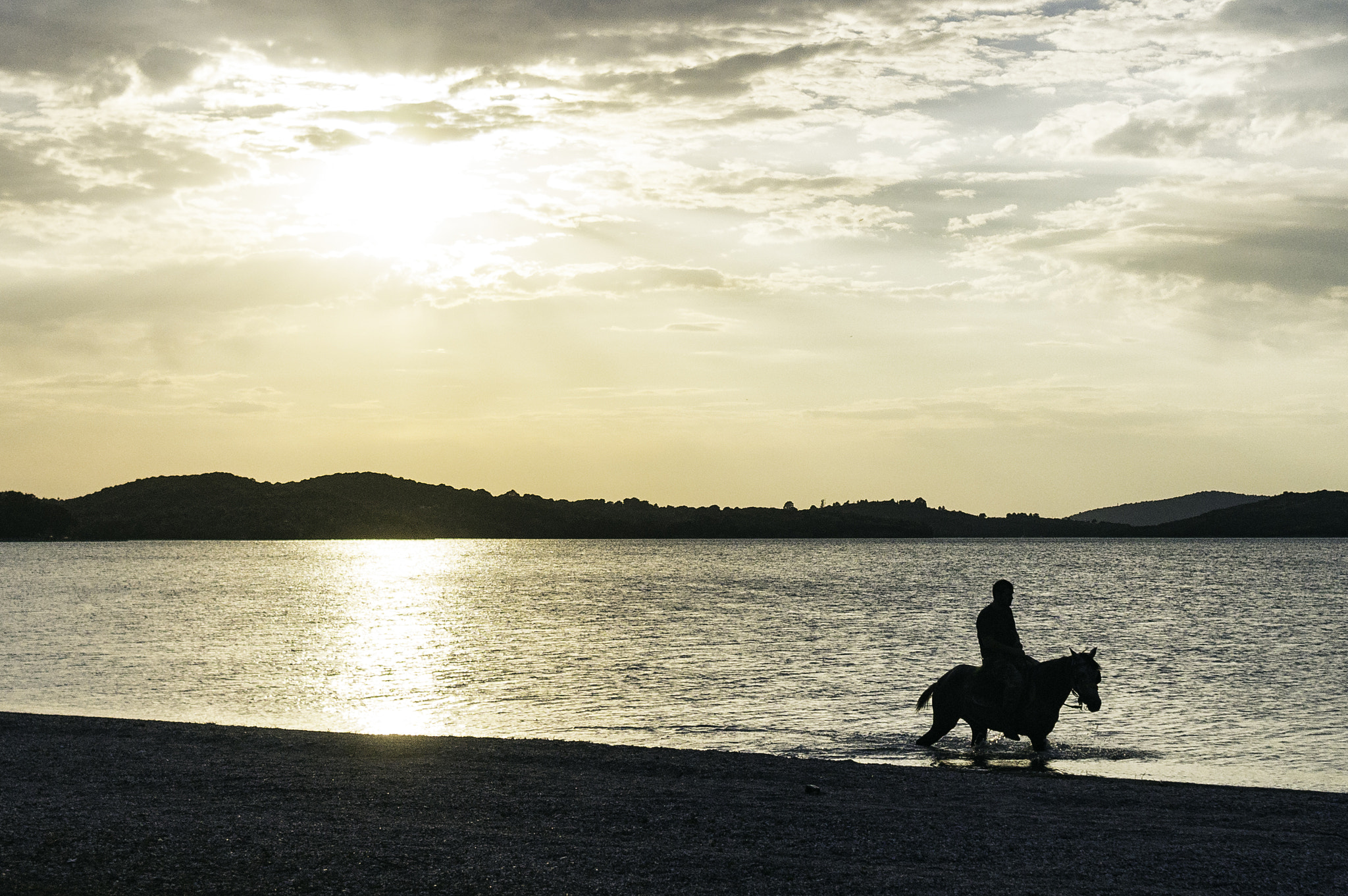 Sony SLT-A37 + Sony 28mm F2.8 sample photo. Riding away photography