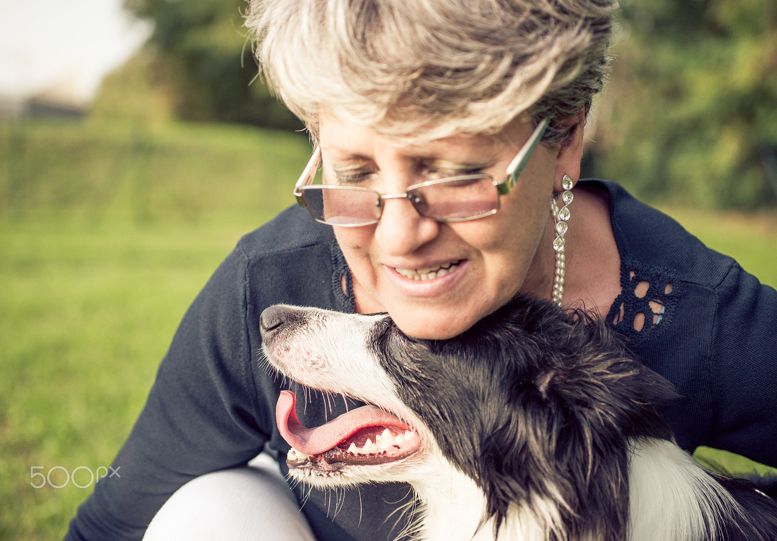 Nikon D610 + Sigma 50mm F2.8 EX DG Macro sample photo. Middle age woman with her dog photography