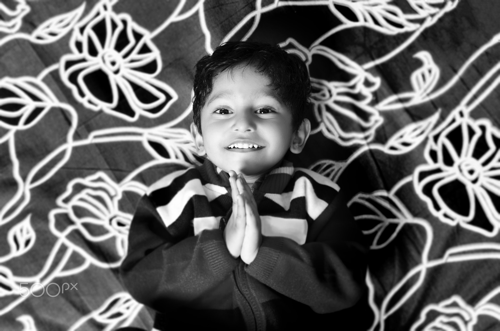 boy child greeting with folded hands saying namaste