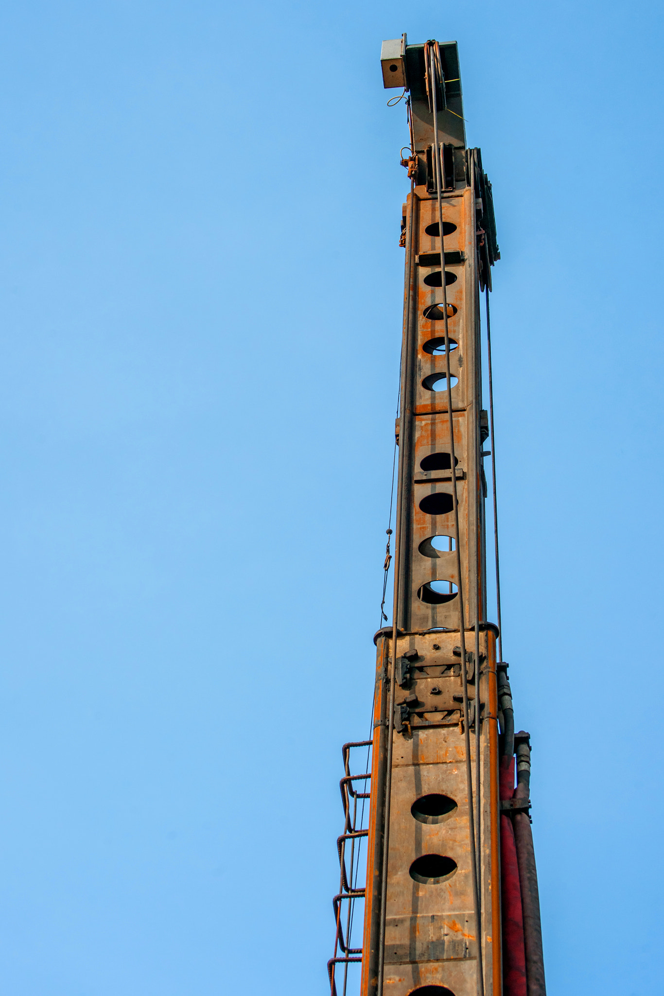 Piling machine isolated on blue background