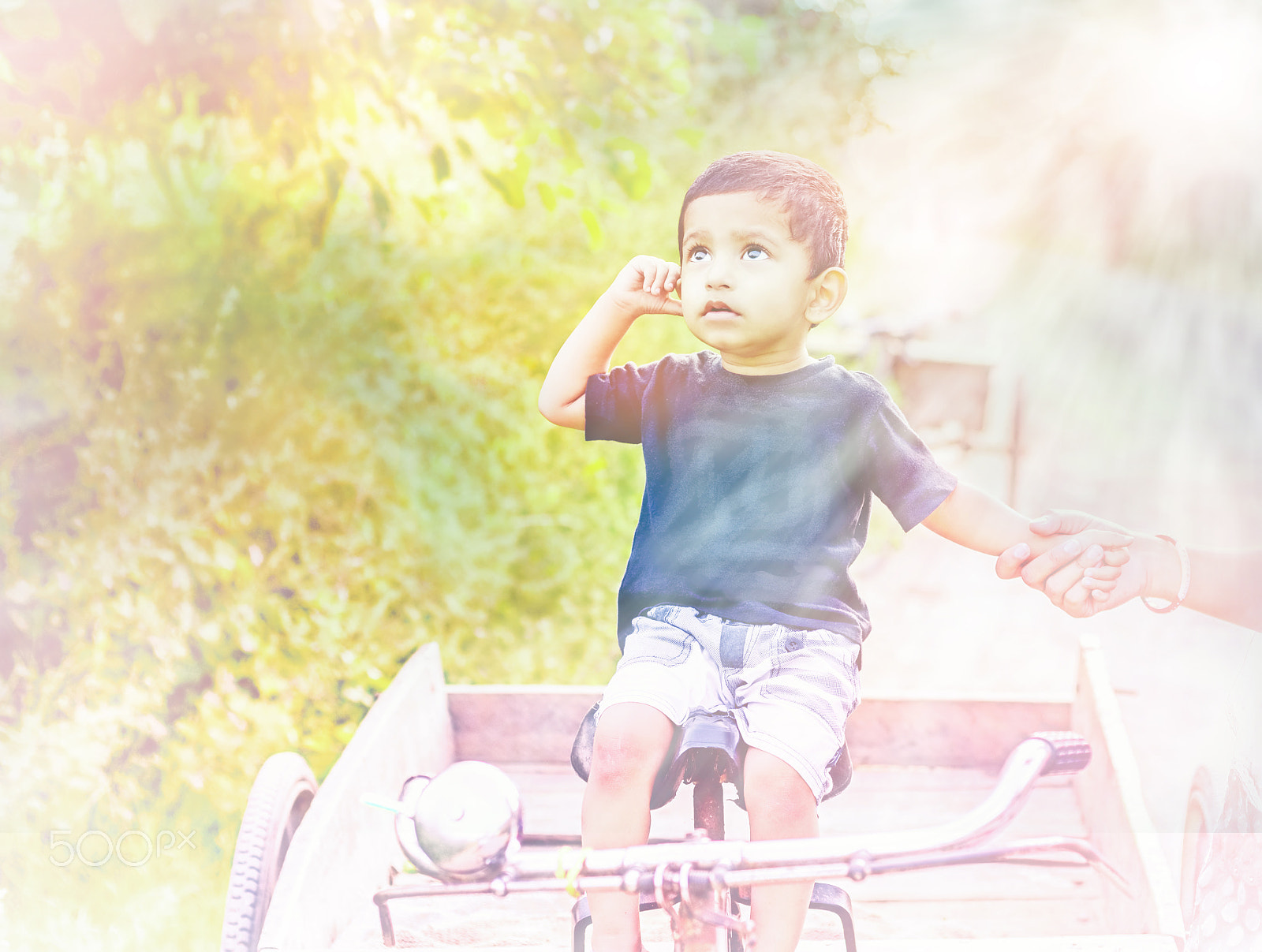 Nikon D5100 + Nikon AF Nikkor 50mm F1.8D sample photo. Curious child photography