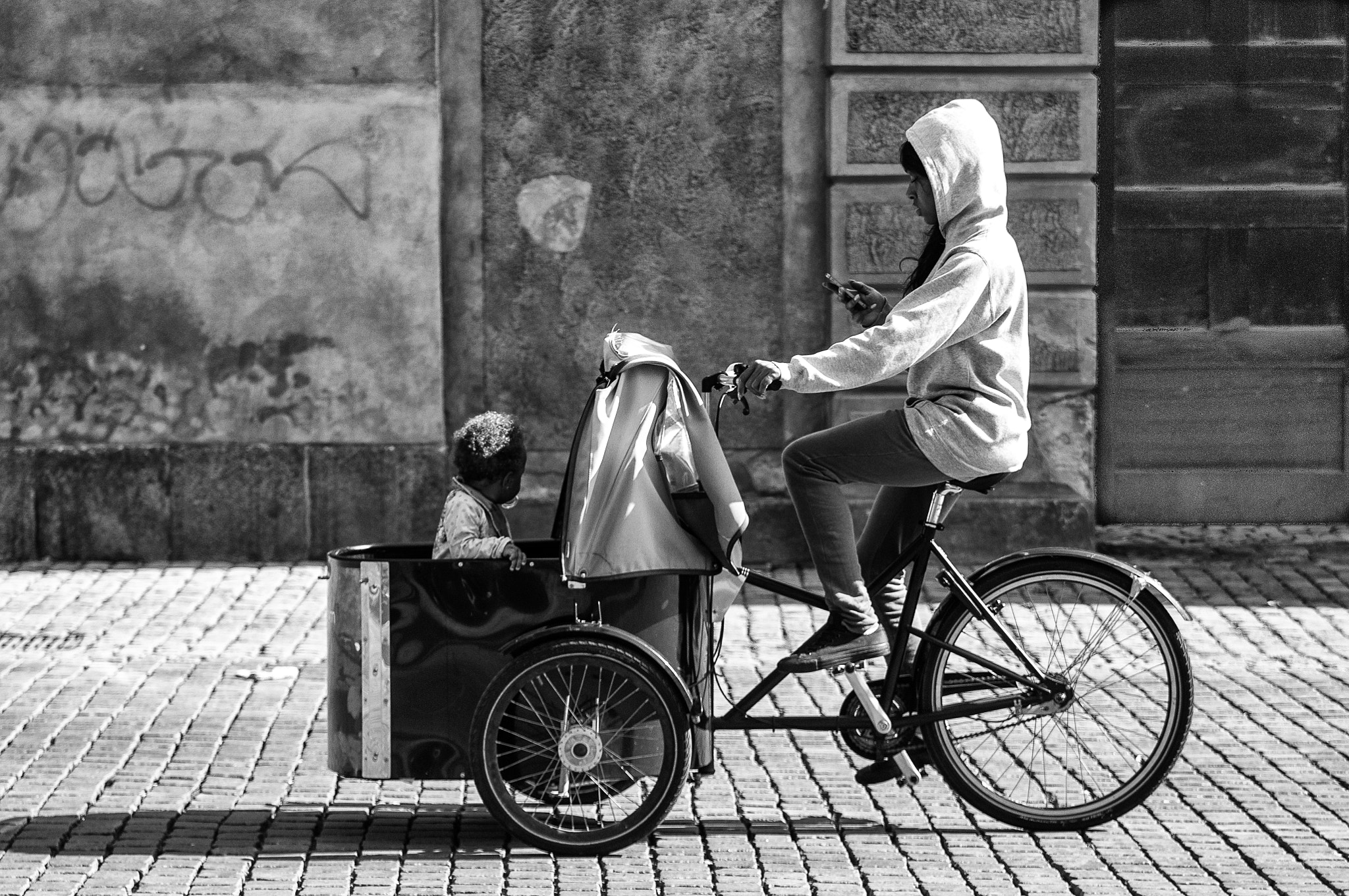 Nikon D300S + Tamron AF 28-75mm F2.8 XR Di LD Aspherical (IF) sample photo. A mother on a bike photography
