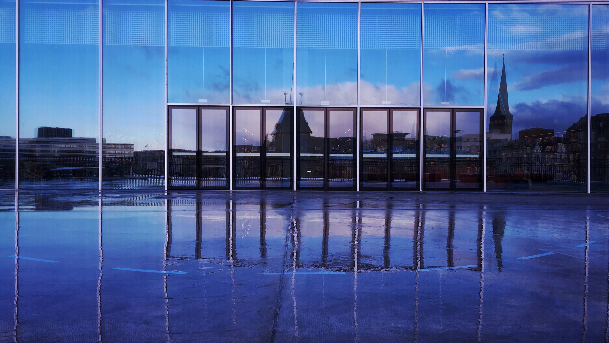 Jag.gr 645 PRO Mk III for iOS sample photo. The city of aarhus, reflected in the rain and windows of the central library at dokk1 photography