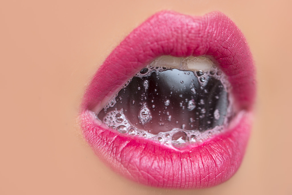 female lips with a bubble of saliva by Volodymyr Tverdokhlib on 500px.com